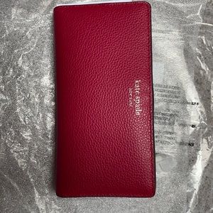 Kate Spade Red Cake wallet with zippered compartment and two rows for cards
